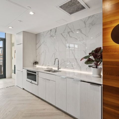 catering style kitchen with warming oven, refrigerator, and dishwasher.