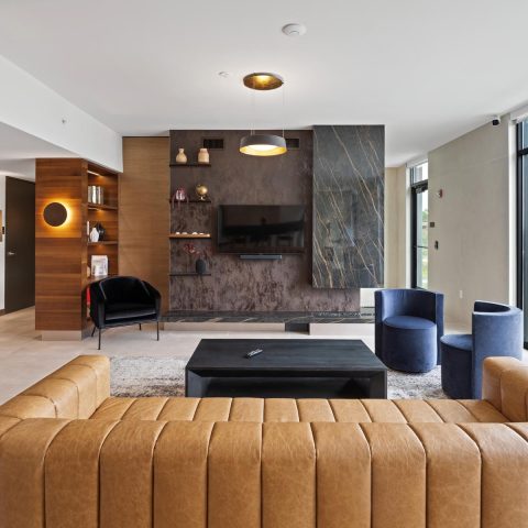 TV and fireside lounge seating in the penthouse club suite